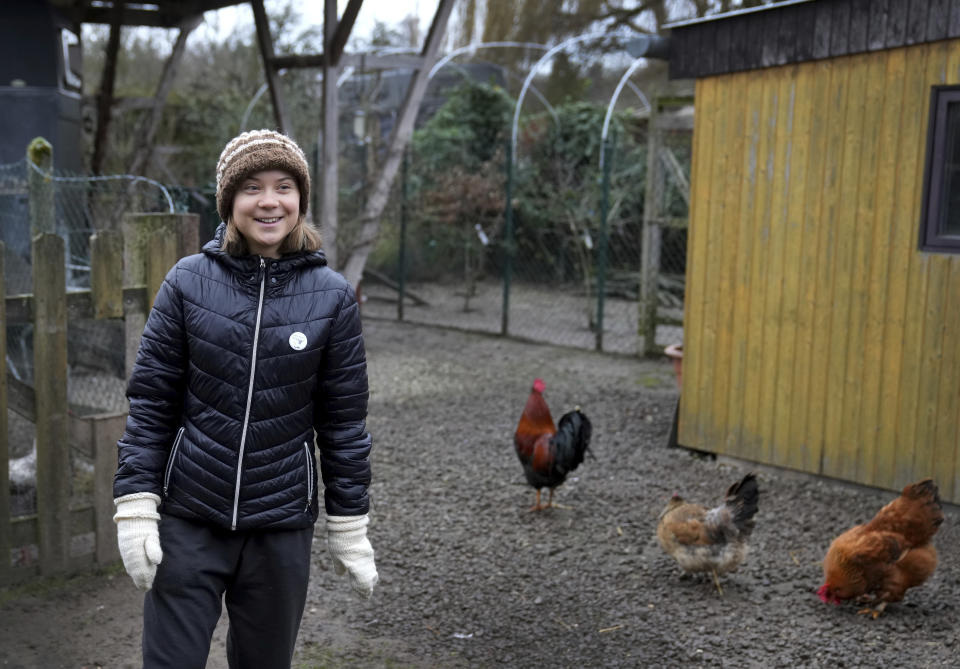 Swedish climate campaigner Greta Thunberg smiles during an interview with the Associated Press in Erkelenz, Germany, Saturday, Jan. 14, 2023. Ahead of a demonstration in which she will take part nearby on Saturday, Thunberg on Friday visited the tiny village of Luetzerath and took a look at the nearby Garzweiler open coal mine. (AP Photo/Michael Probst)