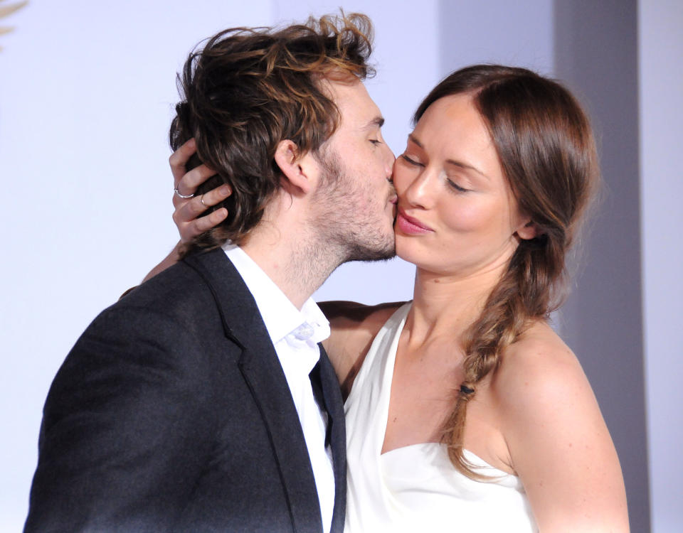 LOS ANGELES, CA - NOVEMBER 17:  (L-R) Actors Sam Claflin and Laura Haddock arrive at the Los Angeles Premiere 'the Hunger Games: Mockingjay Part 1' at Nokia Theatre L.A. Live on November 17, 2014 in Los Angeles, California.  (Photo by Barry King/FilmMagic)