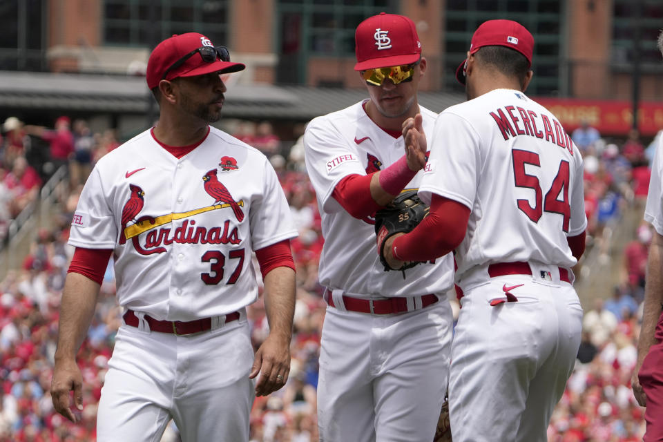 St. Louis Cardinals' Lars Nootbaar, center, pats his replacement, Oscar Mercado (54), as manager Oliver Marmol (37) watches while Nootbaar leaves a baseball game against the Kansas City Royals due to injury during the third inning Monday, May 29, 2023, in St. Louis. (AP Photo/Jeff Roberson)