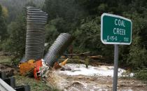 Culverts and a boat are piled up after a flash flood in Coal Creek destroyed bridges near Golden, Colorado September 12, 2013. Flooding in Colorado left two people dead, prompted hundreds to be evacuated, caused building collapses and stranded cars, officials said. REUTERS/Rick Wilking (UNITED STATES - Tags: DISASTER ENVIRONMENT)