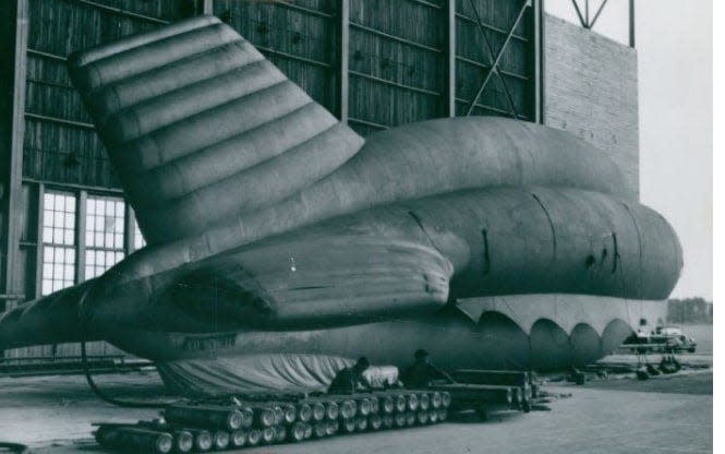 A Goodyear barrage balloon is filled with helium in 1941 at the Wingfoot Lake hangar in Suffield Township.