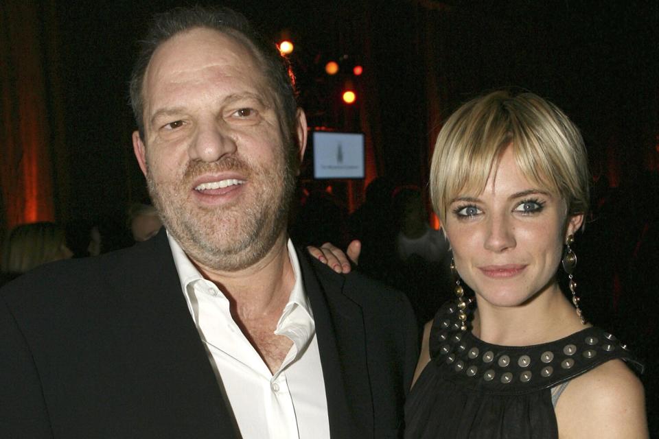 Producer Harvey Weinstein (L) and actress Sienna Miller (R) attend the Weinstein Co. Pre-Oscar Party at the Pacific Design Center on March 4, 2006 in Los Angeles, California.