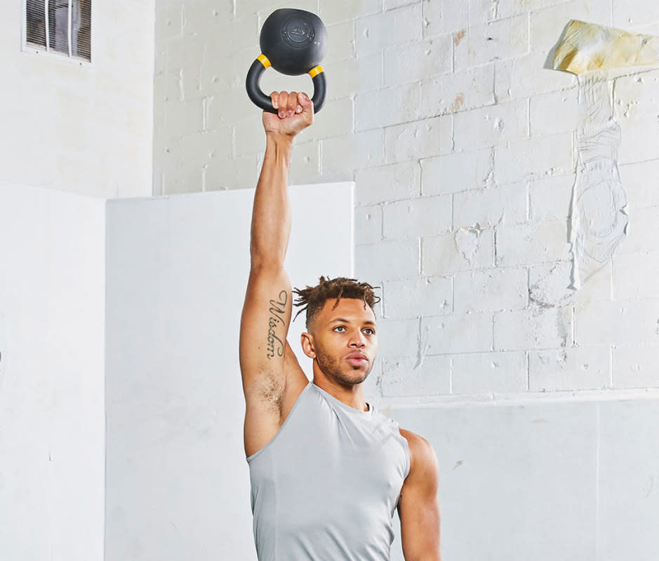 <p>Marius Bugge</p>How to Do It<ol><li>Stand tall with your feet shoulder-width apart, gripping a kettlebell in one hand by the handle. Use both hands to help position the kettlebell upside down, so the bell is pointing toward the ceiling, and rack it by your shoulder, to start. </li><li>Keeping your wrist perfectly straight and the kettlebell steady, press your arm straight up, extending your elbow.</li><li>Carefully bend your elbow and lower the kettlebell back to shoulder height. That's 1 rep. Complete all reps on one side, then switch.</li></ol>