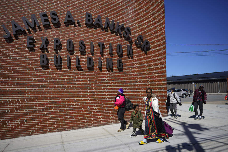 Asylum seekers at the Portland Expo Center, Monday, April 10, 2023, in Portland, Maine. The state is reopening a basketball arena for immigrants following the arrival of more than 800 asylums seekers since the beginning of the year. (AP Photo/Robert F. Bukaty)