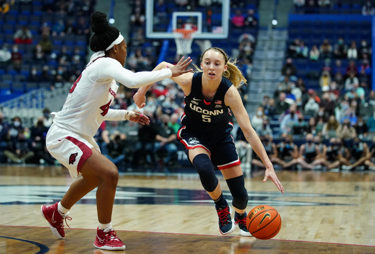 UConn guard Paige Bueckers moves the ball against Arkansas guard Makayla Daniels.