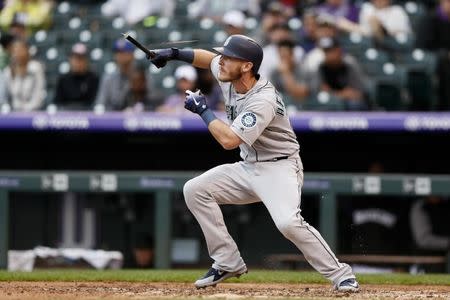 Jul 15, 2018; Denver, CO, USA; Seattle Mariners pinch hitter Chris Herrmann (26) breaks his bat in the ninth inning against the Colorado Rockies at Coors Field. Mandatory Credit: Isaiah J. Downing-USA TODAY Sports