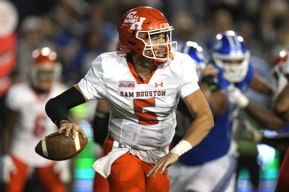 Sam Houston State quarterback Keegan Shoemaker looks down field during the first half of the team's NCAA college football game against BYU on Saturday, Sept. 2, 2023, in Provo, Utah. (AP Photo/Rick Bowmer)