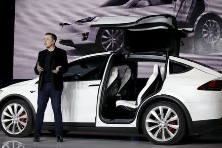 FILE PHOTO: Tesla Motors CEO Elon Musk introduces the falcon wing door on the Model X electric sports-utility vehicles during a presentation in Fremont, California, U.S. September 29, 2015. REUTERS/Stephen Lam/File Photo/File Photo