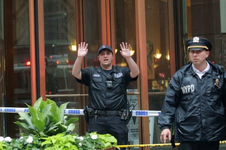 New York City Police Department officers outside 787 7th Avenue in midtown Manhattan where helicopter crashed in New York