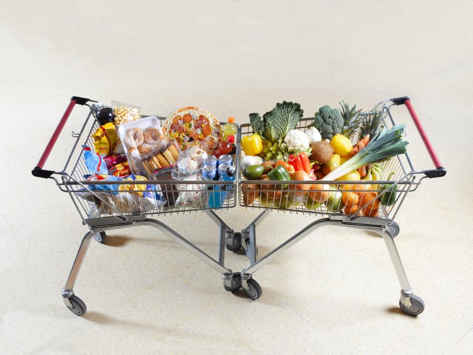 The field of nutrigenomics aims to decipher how different types of foods transmit different – and important – messages to our cells. <a href="https://www.gettyimages.com/detail/photo/healthy-vs-unhealthy-shopping-trolleys-royalty-free-image/108821364?adppopup=true" rel="nofollow noopener" target="_blank" data-ylk="slk:Peter Dazeley/The Image Bank via Getty Images;elm:context_link;itc:0;sec:content-canvas" class="link ">Peter Dazeley/The Image Bank via Getty Images</a>