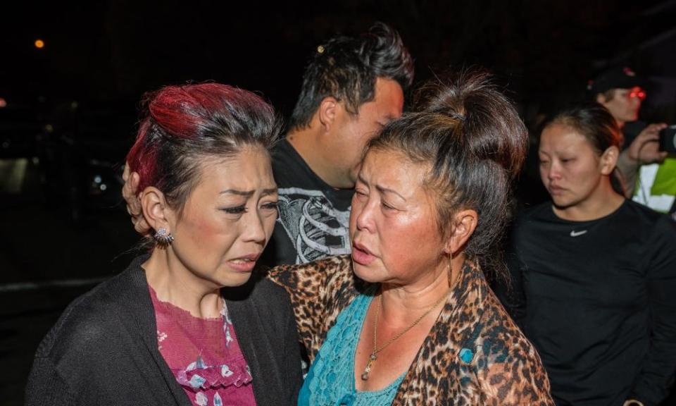 People react near the scene of the Fresno shooting.