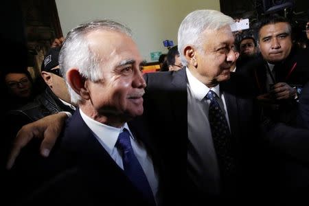 Mexico's President-elect Andres Manuel Lopez Obrador (R) embraces his top economic adviser and chief of staff nominee Alfonso Romo while arriving at a meeting with the Business Coordinating Council (CCE) in Mexico City, Mexico July 4, 2018. REUTERS/Daniel Becerril