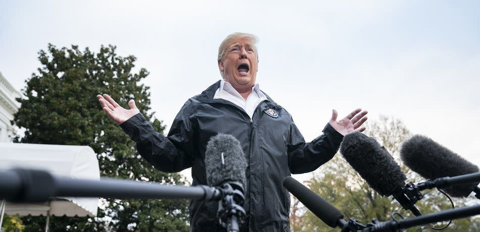 U.S. President Donald Trump speaks to the media before departing the White House for California, where he is scheduled to view damage from the state's wildfires, on November 17, 2018 in Washington, DC.