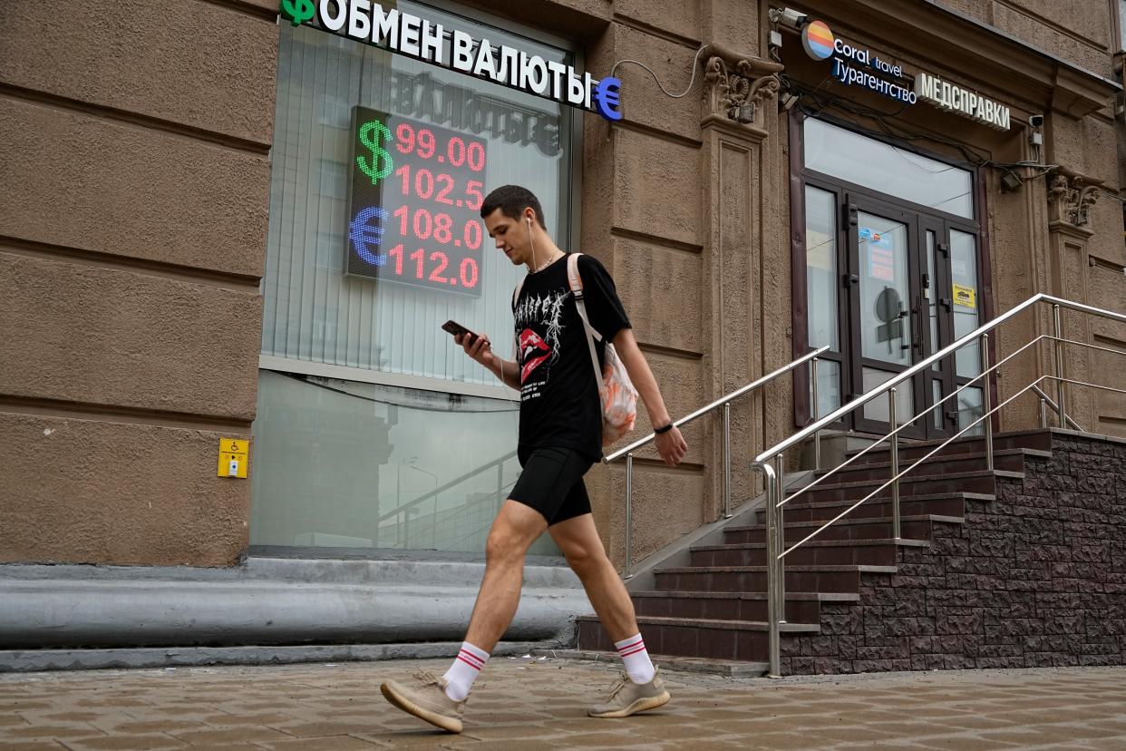 A man walks past a currency exchange office in Moscow, Russia, Monday, Aug. 14, 2023. Russia’s central bank made a big interest rate hike of 3.5 percentage points on Tuesday, (AP)