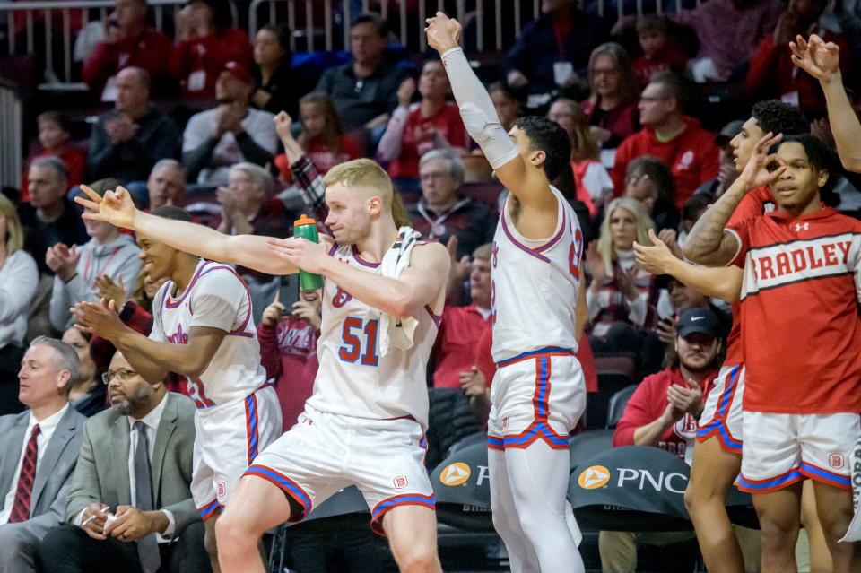 Bradley's Rienk Mast (51) and his teammates react to a Braves' three-pointer in the second half Saturday, Feb. 11, 2023 at Carver Arena. The Braves rolled over the Murray State Racers 83-48.