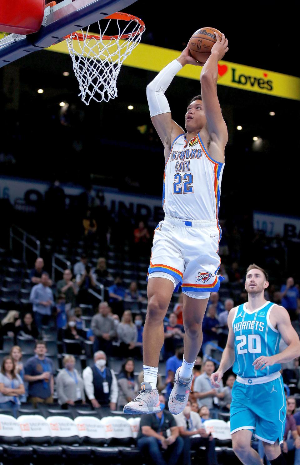 Oklahoma City's Isaiah Roby (22) dunks the ball in front of Charlotte's Gordon Hayward (20) in the first half during the preseason NBA game between the Oklahoma City Thunder and the Charlotte Hornets at Paycom Center in Oklahoma City, Monday, Oct. 4, 2021. 