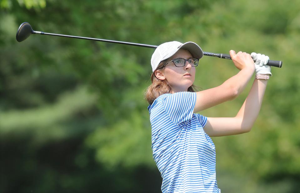 Hudson's Emily Burling follows her tee shot during the Hudson Junior Invitational this summer.