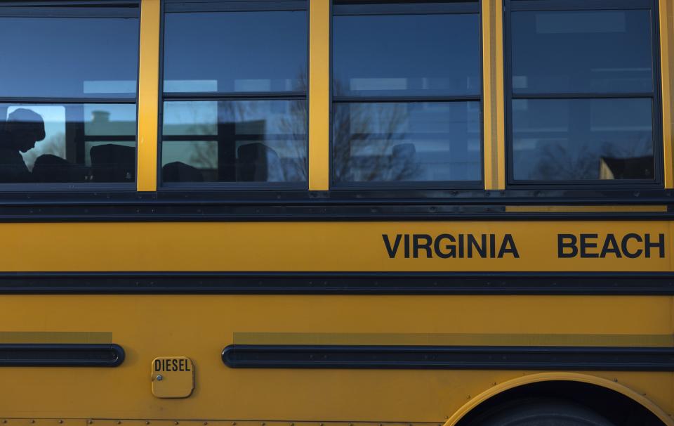 A student is silhouetted while aboard a diesel school bus, Tuesday, Feb. 6, 2024, in Virginia Beach, Va. Diesel exhaust from school buses affects one-third of U.S. students, their parents and educators each day. (AP Photo/Tom Brenner)