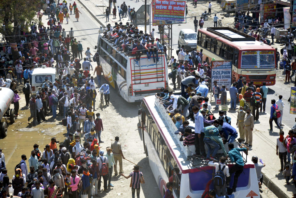 GHAZIABAD, INDIA - MARCH 28: An aerial view of Lal Kuan bus stand where a wave of migrant workers was seen following Uttar Pradesh governments call to arrange buses for the workers returning to their native state, on Day 4 of the 21 day nationwide lockdown -- to check the spread of coronavirus, on March 28, 2020 in Ghaziabad, India. (Photo by Sakib Ali/Hindustan Times via Getty Images)