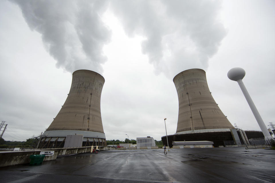 FILE - This May 22, 2017 file photo, shows cooling towers at the Three Mile Island nuclear power plant in Middletown, Pa. The shutdown of Three Mile Island, site of the United States' worst commercial nuclear power accident, is imminent. Exelon Corp. officials said the plant will stop producing electricity Friday, Sept. 20, 2019, following through on a decision the Chicago-based energy giant made in May after it became clear that it would not get a financial rescue from Pennsylvania. (AP Photo/Matt Rourke, File)