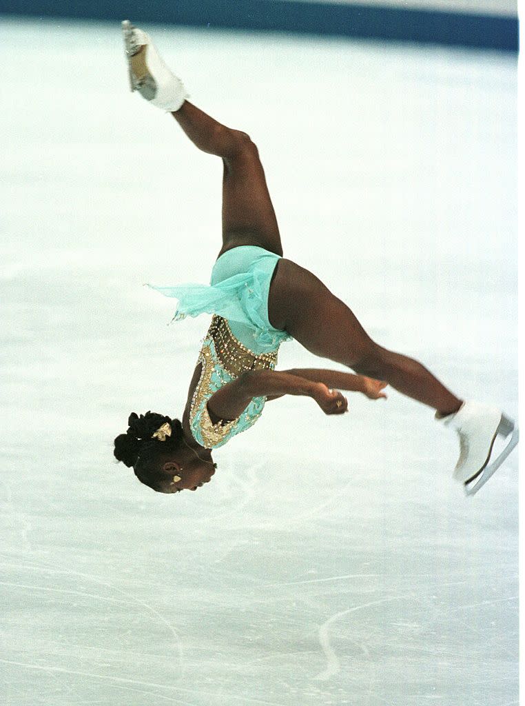 France's Surya Bonaly does a back flip during the women's long program at the White Ring at the 1998 Winter Olympics in Nagano.<span class="copyright">John Tlumacki—The Boston Globe via Getty Images</span>