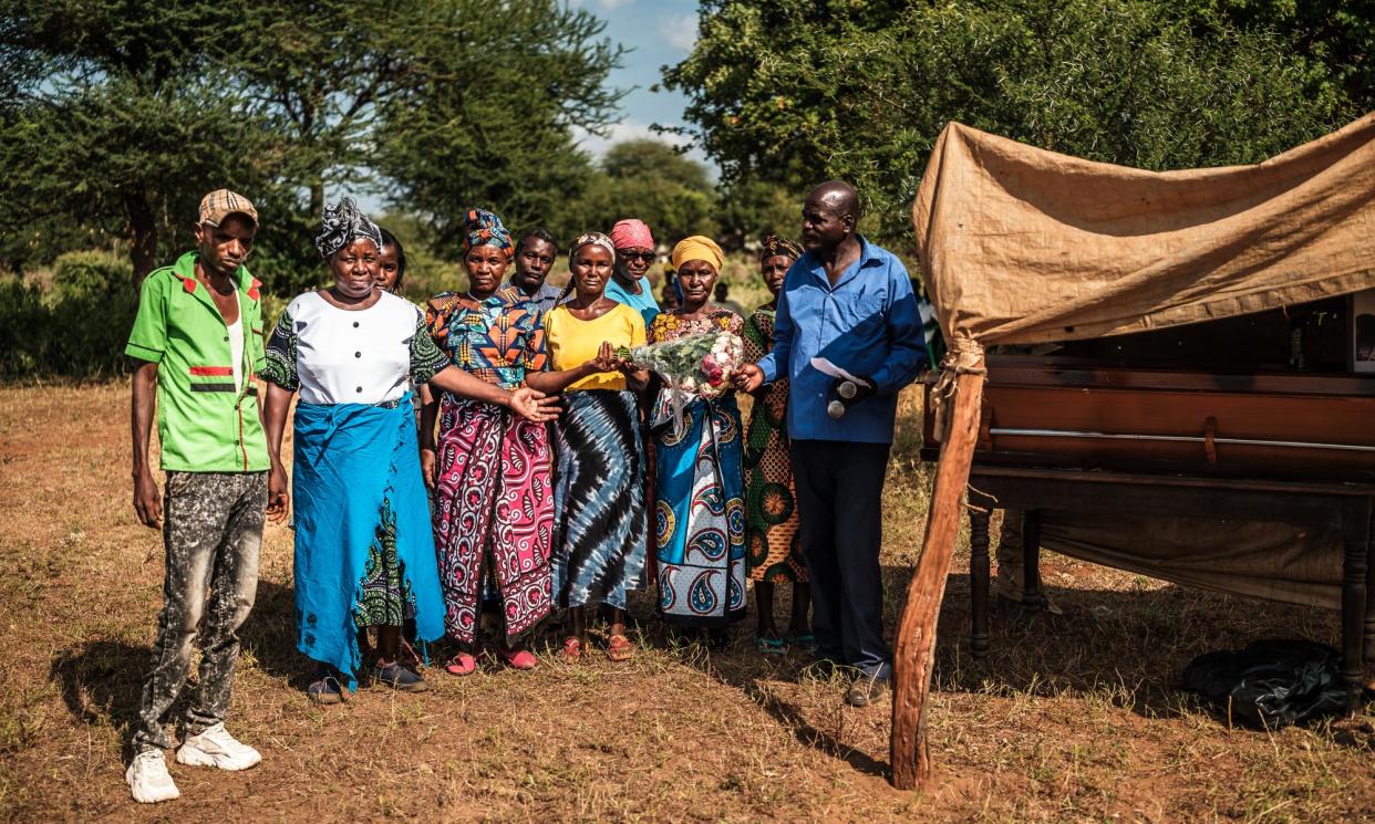 <span>Friends and family of Francis Muimi, who died in December.</span><span>Photograph: Brian Otieno/The Guardian</span>