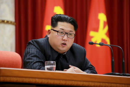 North Korean leader Kim Jong Un speaks during a ceremony to award party and state commendations to nuclear scientists, technicians, soldier-builders, workers and officials for their contribution to what North Korea said was a succesful hydrogen bomb test, at the meeting hall of the Central Committee of the Workers' Party of Korea (WPK) in this undated photo released by North Korea's Korean Central News Agency (KCNA) on January 13, 2016. REUTERS/KCNA