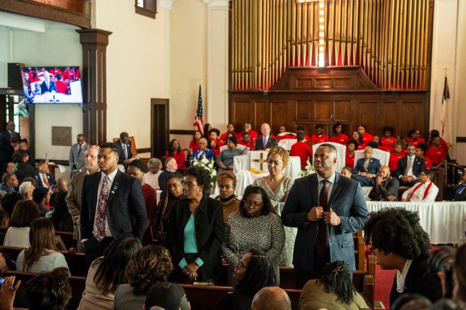 A group of guest stand and face the opposite way as Presidential candidate Mike Bloomberg speaks during the Jubilee at Brown Chapel AME Church in Selma, Ala., on Sunday, March 1, 2020. 