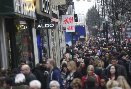 FILE PHOTO: Shoppers walk along Oxford Street in London, Britain December 18, 2016. REUTERS/Neil Hall/File Photo