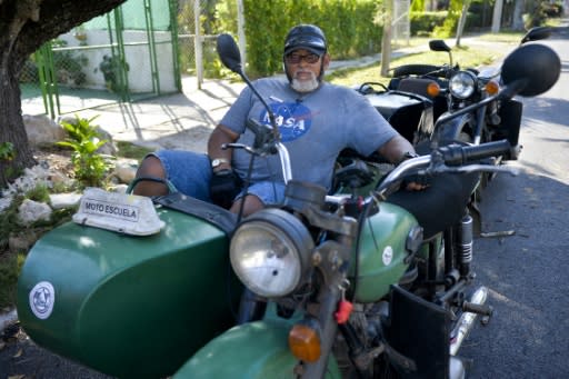 The retro appeal gets a lot of attention from tourists "but here it's common, normal," says Enrique Oropesa Valdez, 59, who teaches people how to handle motorcycle sidecars in Havana's traffic