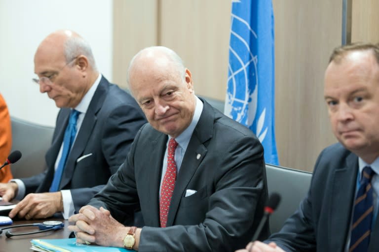 United Nations (UN) Syria envoy Staffan de Mistura (centre) looks on during a meeting on the second day of a new round of Syria peace talks, on February 24, 2017 in Geneva