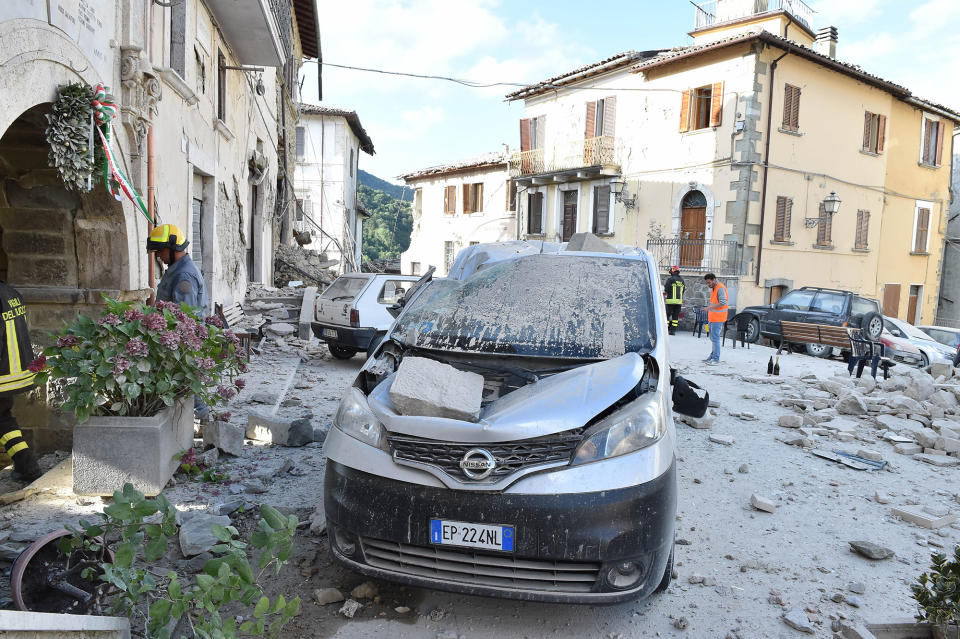 <p>A damaged car is seen on August 24, 2016 in Arquata del Tronto, Italy. Central Italy was struck by a powerful, 6.2-magnitude earthquake in the early hours, which has killed at least thirteen people and devastated dozens of mountain villages. Numerous buildings have collapsed in communities close to the epicenter of the quake near the town of Norcia in the region of Umbria, witnesses have told Italian media, with an increase in the death toll highly likely. (Giuseppe Bellini/Getty Images) </p>