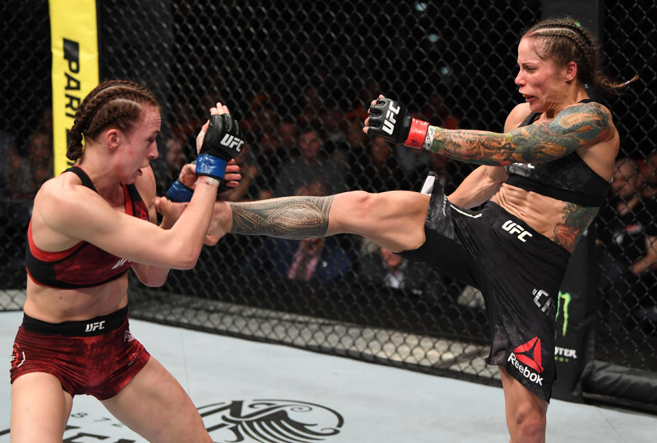 PRAGUE, CZECH REPUBLIC - FEBRUARY 23:  (R-L) Liz Carmouche kicks Lucie Pudilova of Czech Republic in their women's flyweight bout during the UFC Fight Night event at O2 Arena on February 23, 2019 in the Prague, Czech Republic. (Photo by Jeff Bottari/Zuffa LLC/Zuffa LLC via Getty Images)