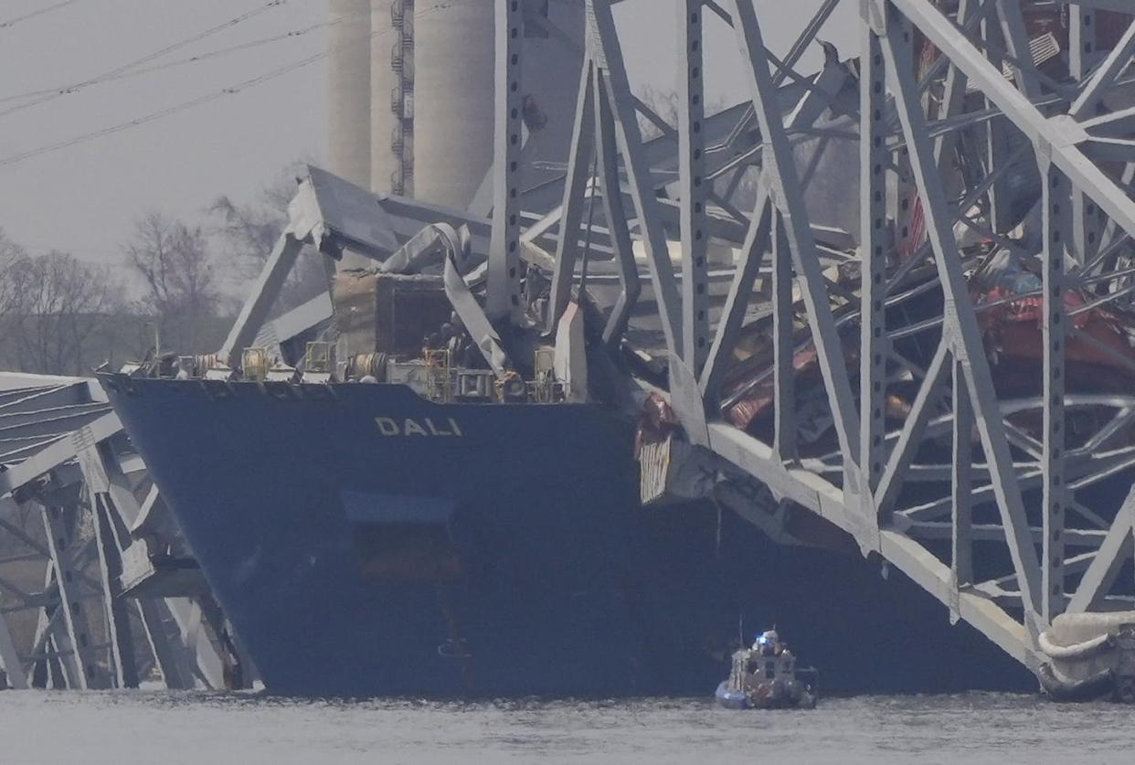 The ship Dali amid the wreckage of the Francis Scott Key Bridge on March 26, 2024. <a href="https://newsroom.ap.org/detail/APTOPIXMarylandBridgeCollapse/b59d34234f344c719d7acd7b9a2491c5/photo?Query=bridge&mediaType=photo&sortBy=creationdatetime:desc&dateRange=Anytime&totalCount=85912&currentItemNo=2" rel="nofollow noopener" target="_blank" data-ylk="slk:AP Photo/Matt Rourke;elm:context_link;itc:0;sec:content-canvas" class="link ">AP Photo/Matt Rourke</a>