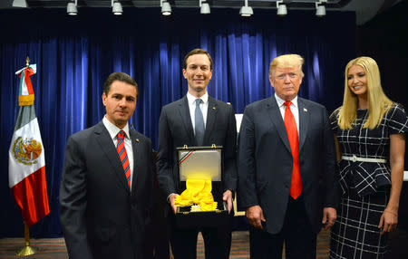 FILE PHOTO: (L-R) Mexican President Enrique Pena Nieto, Jared Kushner, U.S. President Donald Trump and his daughter Ivanka Trump pose for a picture after Kushner received the Order of the Aztec Eagle from Pena Nieto before the G20 leaders summit in Buenos Aires, Argentina, Nov. 30, 2018. Mexico Presidency/Handout via REUTERS/File Photo