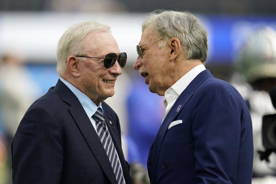 Dallas Cowboys team owner Jerry Jones, left, talks with Stan Kroenke, Los Angeles Rams owner before an NFL football game, Sunday, Oct. 9, 2022, in Inglewood, Calif. (AP Photo/Marcio Jose Sanchez)