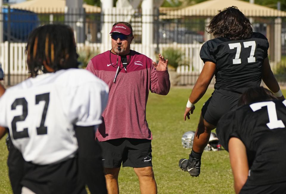 Hamilton football head coach Michael Zdebski speaks to his team during a practice at Hamilton High School in Chandler on Oct. 18, 2022.