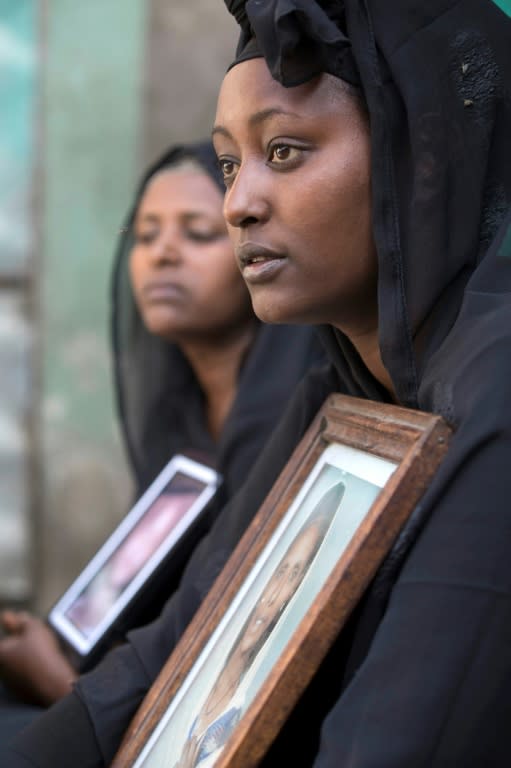 Zemed Derib, who lost family in the landslide, is pictured with a photograph of her mother, Yeshi, on March 18 2017, in Addis Ababa