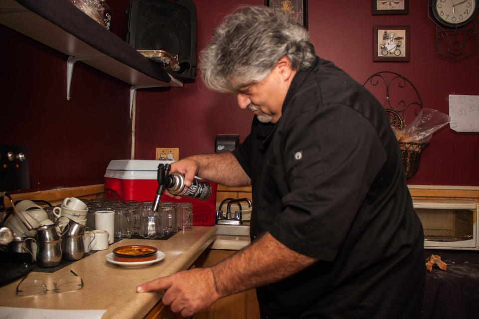 Umberto Turelli, pictured in 2015, takes a torch to an order of crème brulée at his now-closed Toms River restaurant, Umberto's Blaze Bistro. His other former restaurants include Nuova Luna in Toms River and Ocean Township, and Trattoria Portobello in Freehold Borough and Seaside Heights.