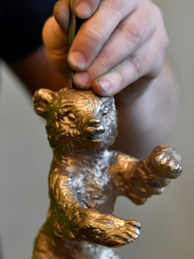 Ahead of the festival a craftsman works on a bear trophy at Berlin's Noack fine art foundry