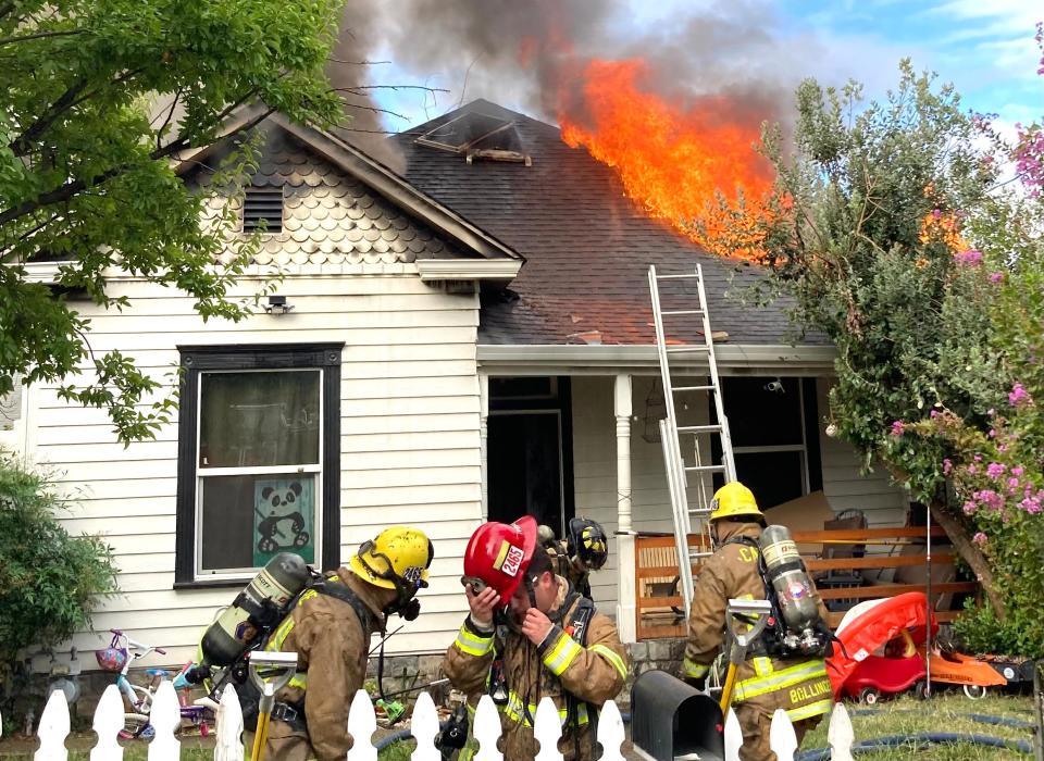 Firefighters battle a house fire off of Willis Street on Wednesday, Sept. 27, 2023.