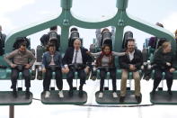 Liberal Democrats leader Sir Ed Davey, 3rd from left, during a visit to Thorpe Park in Chertsey, England, whilst on the General Election campaign trail, Monday June 10, 2024. (Lucy North/PA via AP)