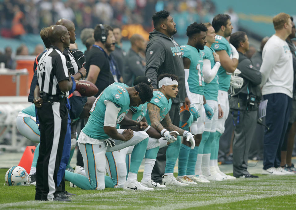 <p>Miami Dolphins players kneel down during the national anthem before the NFL game between the Miami Dolphins and the New Orleans Saints at Wembley Stadium on October 1, 2017 in London, England. (Photo by Henry Browne/Getty Images) </p>