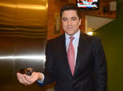 Josh Elliott holds a tiny Beyonce in the palm of his hand.