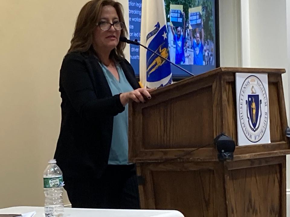 Roxana Rivera of 32BJ SEIU, speaks Thursday at a rally at the State House in favor of a bill that would change Massachusetts labor laws to allow rideshare drivers to organize and bargain collectively for better working conditions.