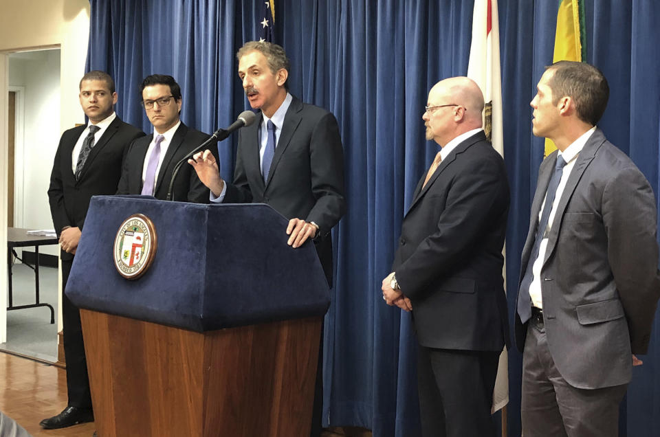 Los Angeles City Attorney Mike Feuer, at podium, speaks at a news conference in Los Angeles Friday, Jan. 4, 2019. Feuer said that owners of The Weather Channel app, one of the most popular mobile weather apps, used it to track people's every step and profit off that information. Feuer said the company misled users of the popular app to think their location data will only be used for personalized forecasts and alerts. A spokesman for app owner IBM Corp. says it's been clear about the use of location data and will vigorously defend its "fully appropriate" disclosures. (AP Photo/Brian Melley)