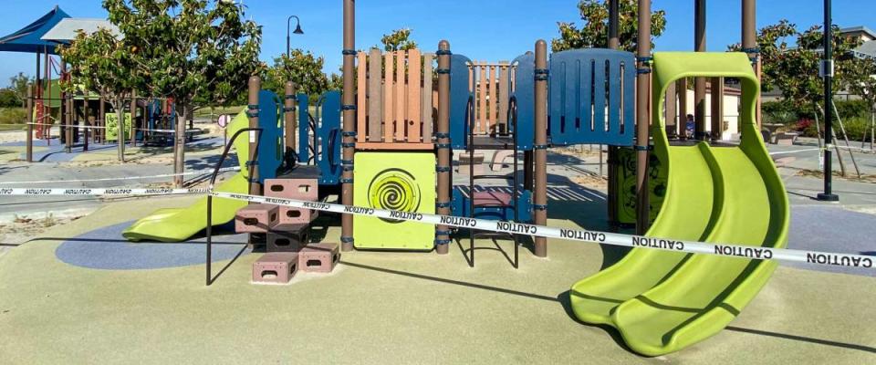 Closed community park with playground for kids due to Covid 19. Coronavirus virus panic and quarantine in San Diego, California, USA.