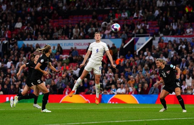 Ellen White, centre, goes for goal against Austria