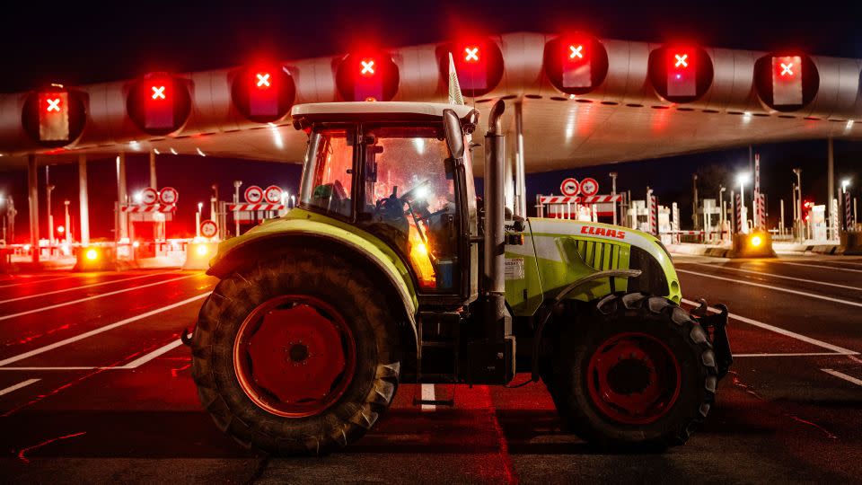 Protesting farmers blockade the A10 highway near the Peage de Saint-Arnoult-en-Yvelines toll gates southwest of Paris. - Dimitar Dilkoff/AFP via Getty Images