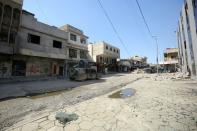 Iraqi forces drive down a street on the frontline of the Old City of Mosul on March 25, 2017